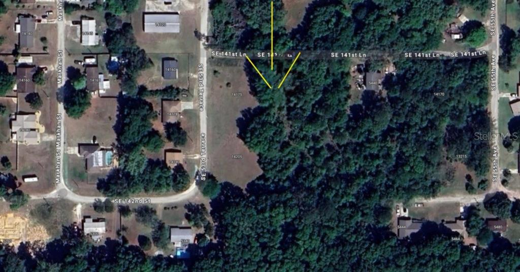 An aerial map view showing a wooded residential lot located between two streets — LOT 2 SE 141ST LANE, SUMMERFIELD, FL