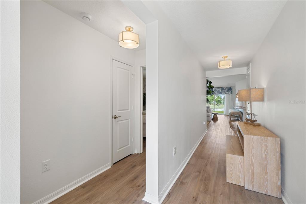 A single-story house with a white garage, gray shutters, and a front lawn — 915 OVERPOOL AVENUE, DAVENPORT, FL
