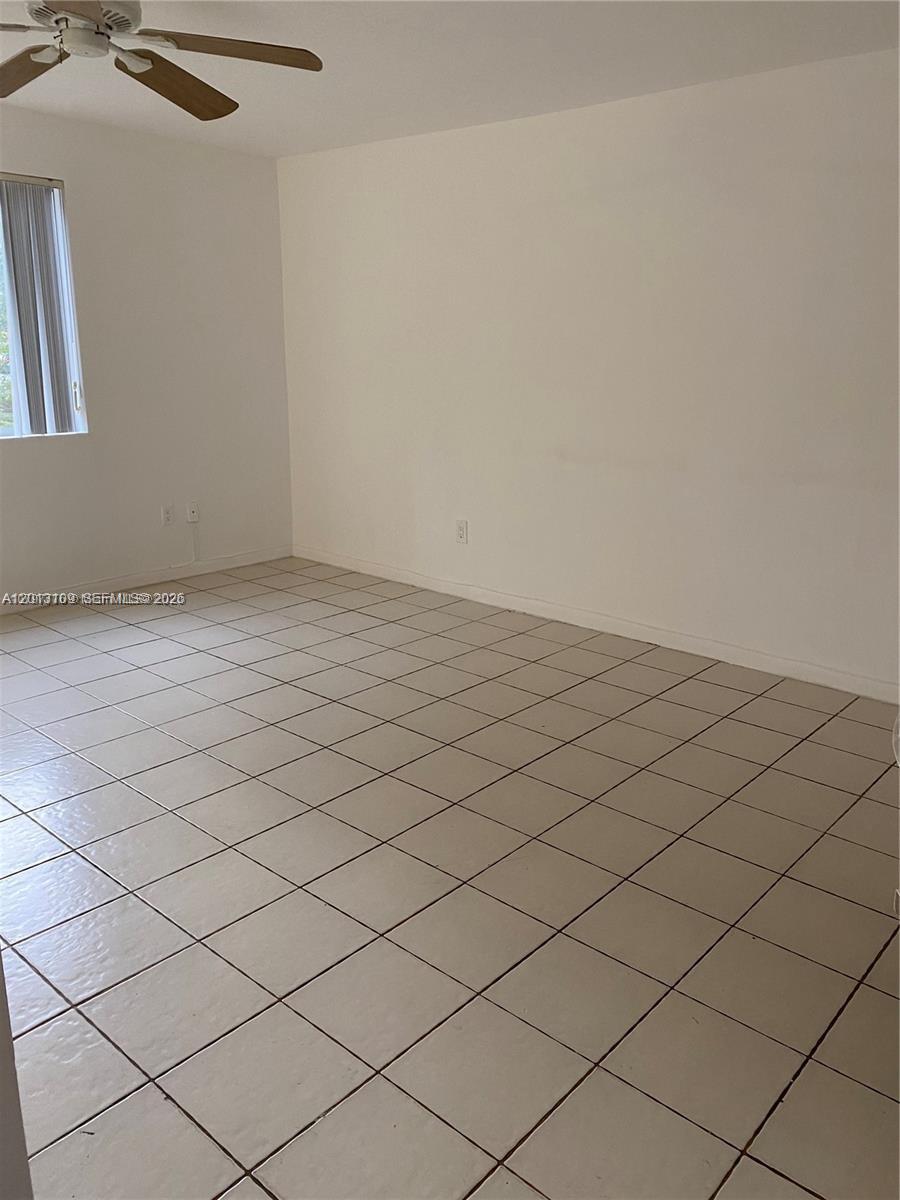 A bathroom features a vanity, toilet, and a shower with a grey curtain — 22221 SW 103rd Ct # 0, Miami FL 33190, MIAMI, FL