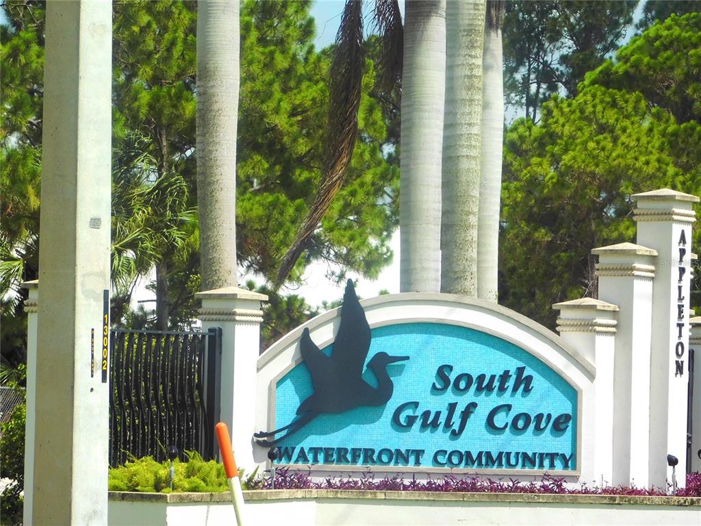 A sign for the South Gulf Cove waterfront community stands near a gated entrance — 16207 RENNIE ROAD, PORT CHARLOTTE, FL
