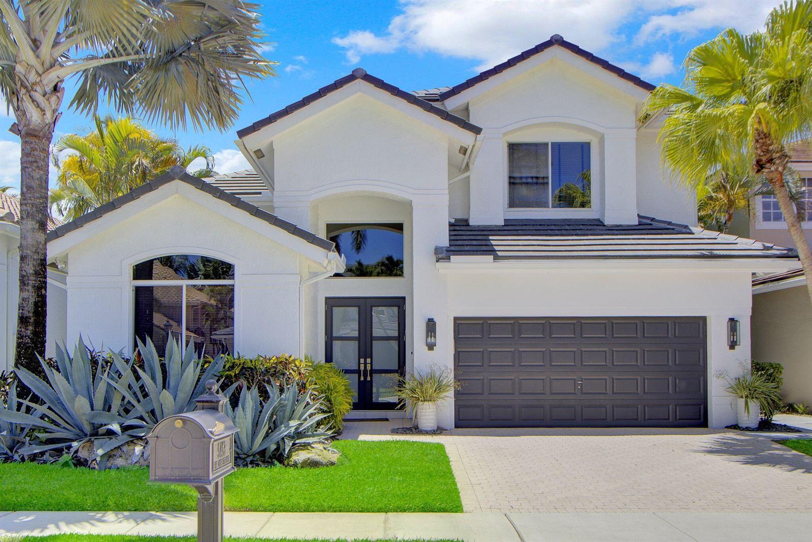 A two-story white house with a dark gray garage door and a front lawn — 5463 NW 41st Terrace, Boca Raton FL 33496, BOCA RATON, FL
