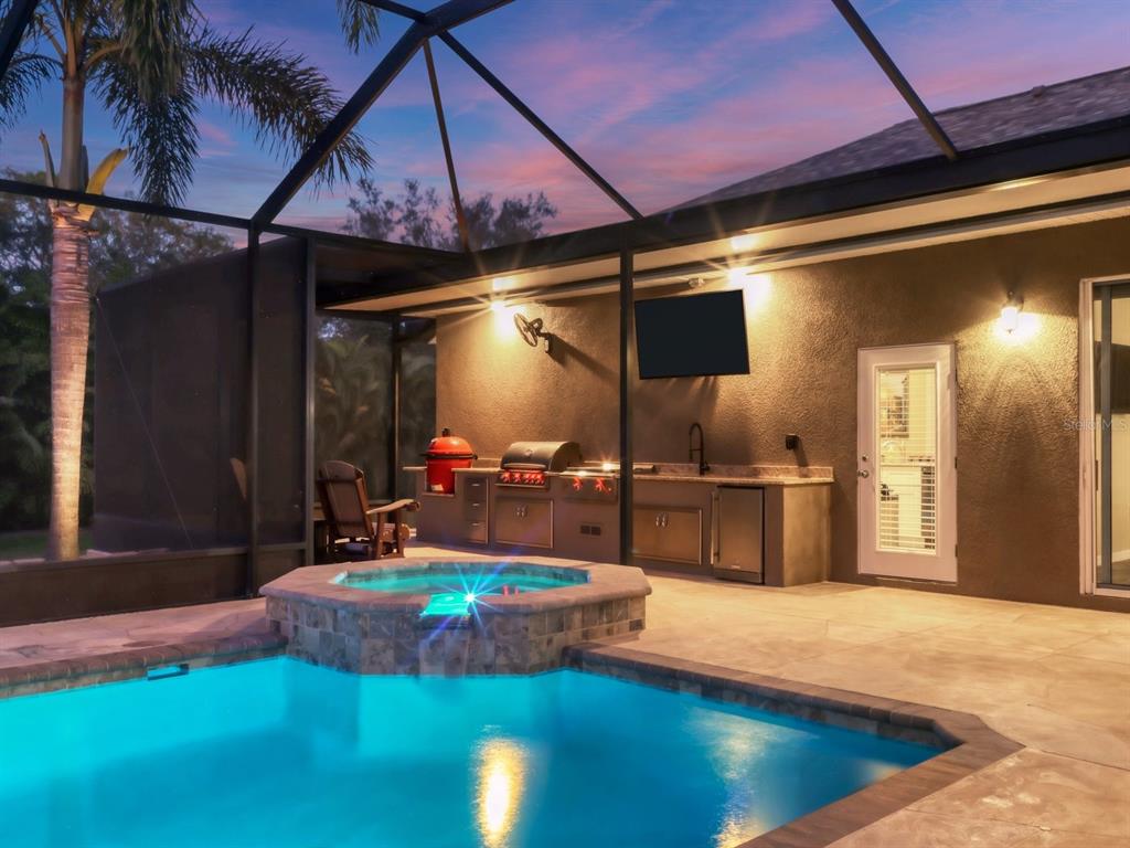 An aerial view shows a single-story house with a gray roof and a fenced backyard — 17706 BRIDLEWOOD COURT, PARRISH, FL