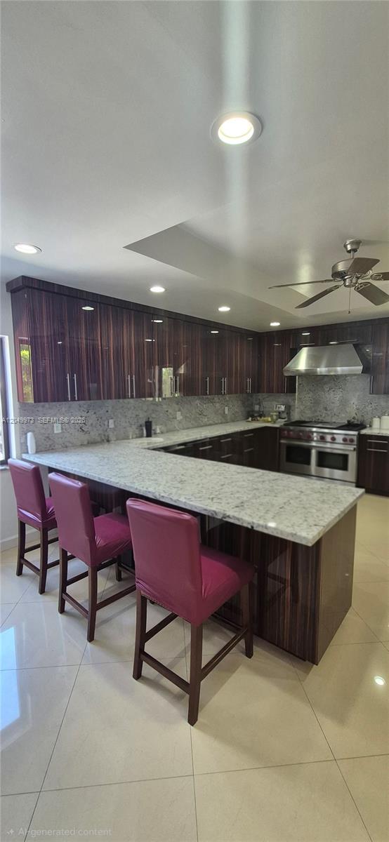 A kitchen features dark wood cabinets, granite countertops, and three magenta bar stools — 3711 SW 122nd Ave, Miami FL 33175, MIAMI, FL