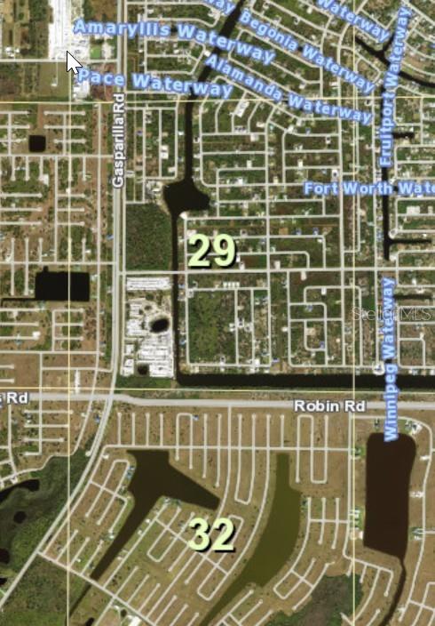 This is an aerial map showing residential streets, waterways, and numbered land sections — 28 CARNATION DRIVE, PLACIDA, FL