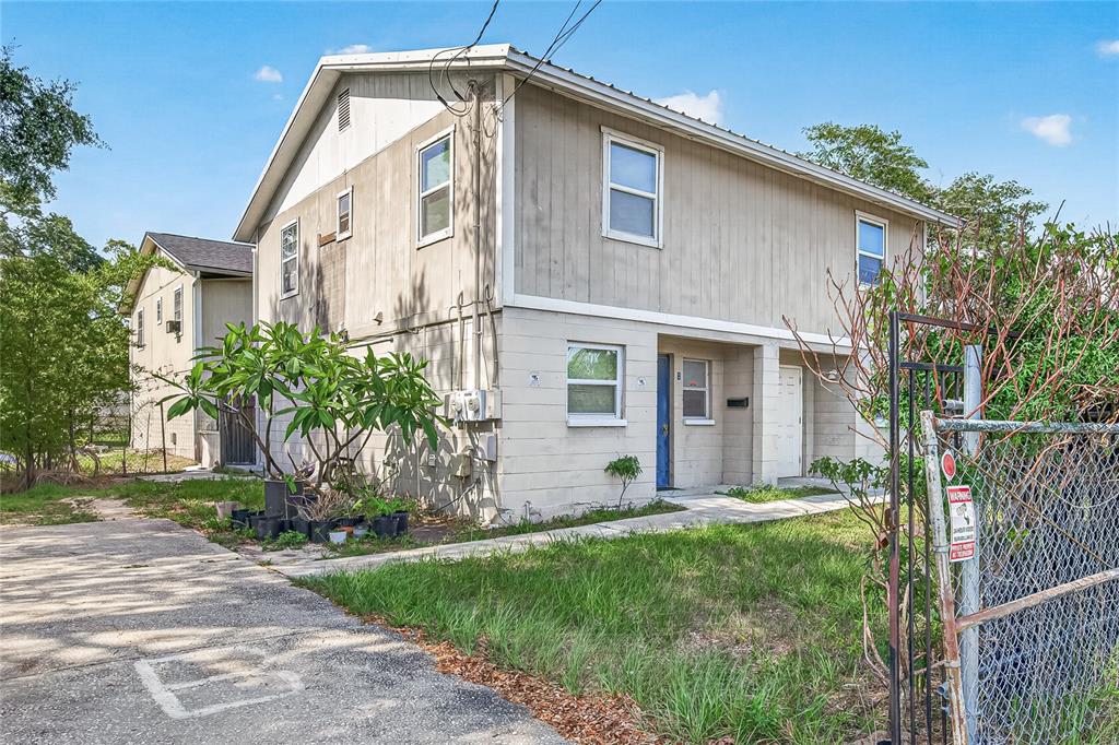 A two-story apartment building with a concrete block lower level and wood siding upper level — 3602 N 54TH STREET, TAMPA, FL