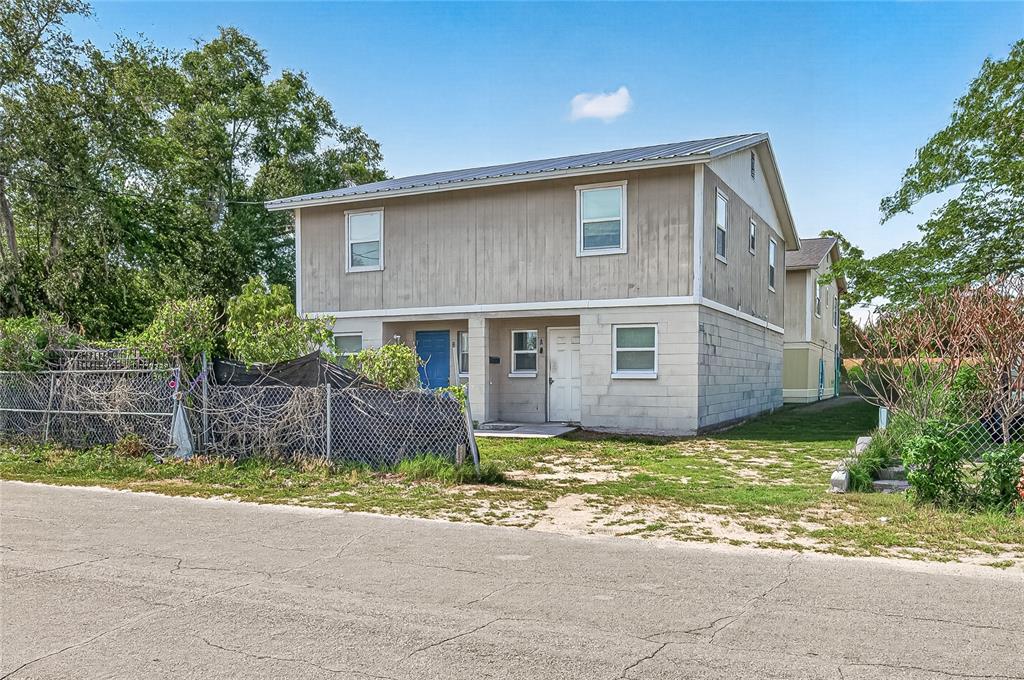A two-story building with a concrete block lower level and wood siding upper level — 3602 N 54TH STREET, TAMPA, FL
