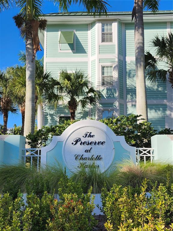 A sign for The Preserve at Charlotte Harbor stands before a light green multi-story building — 5127 MELBOURNE STREET UNIT F103, PUNTA GORDA, FL
