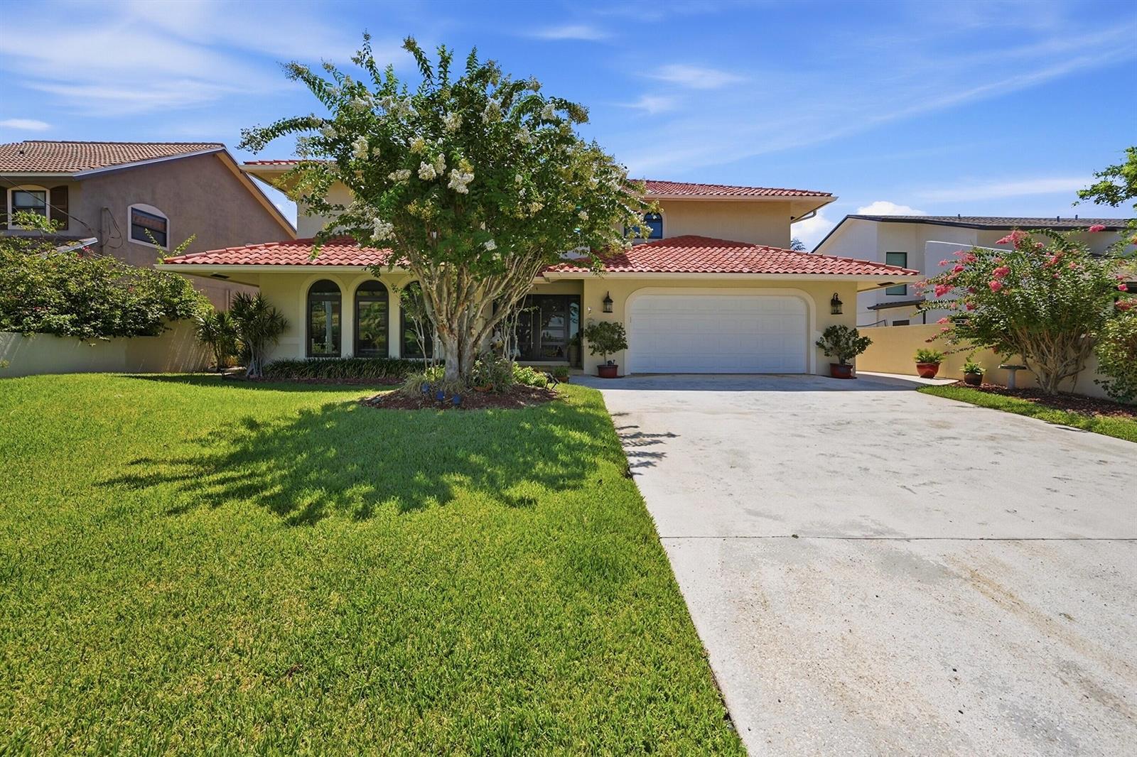 A two-story house with a red tile roof, a white garage door, and a large tree — 370 SE 13th Avenue, Pompano Beach FL 33060, POMPANO BEACH, FL