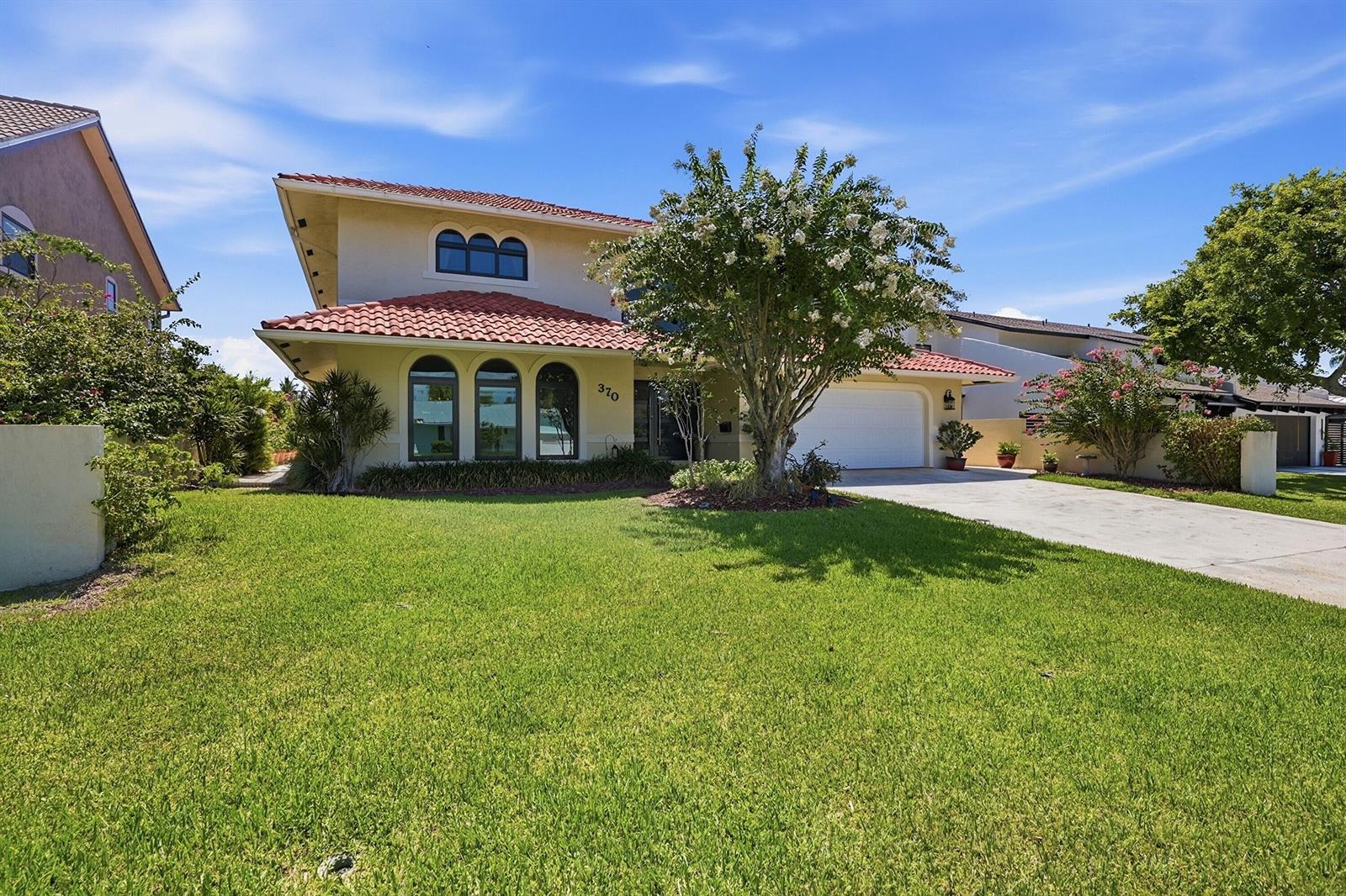 A two-story house with a red tile roof, arched windows, and a front lawn — 370 SE 13th Avenue, Pompano Beach FL 33060, POMPANO BEACH, FL