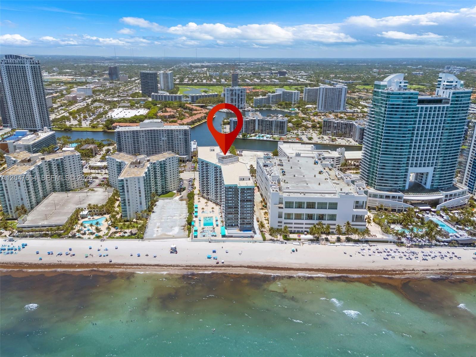 An aerial view shows a beachfront condominium building marked with a red location pin — 3725 S Ocean Dr, Hollywood FL 33019, HOLLYWOOD, FL