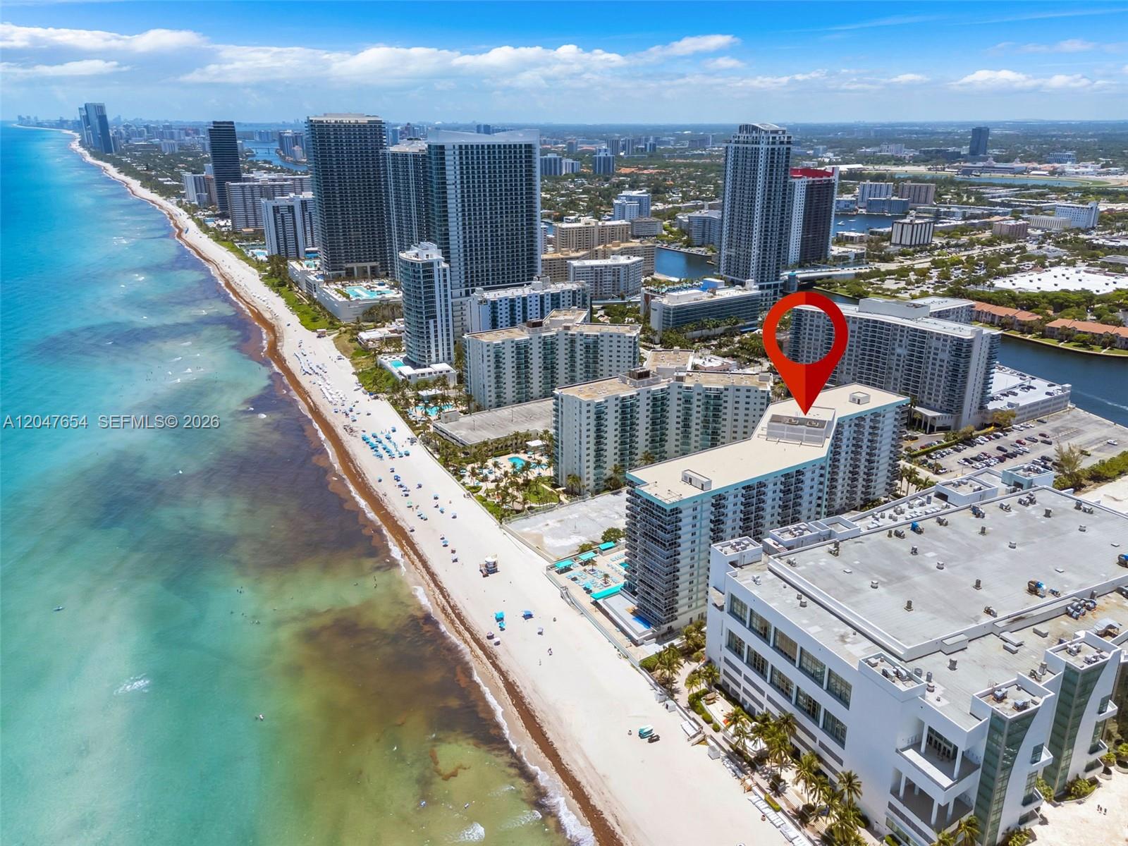 An aerial view shows a high-rise beachfront condominium building marked with a red location pin — 3725 S Ocean Dr, Hollywood FL 33019, HOLLYWOOD, FL