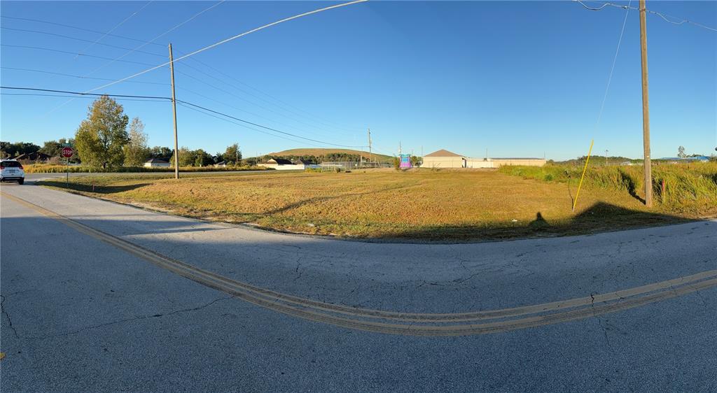 A vacant, grassy corner lot sits at the intersection of two paved roads — 0 DOGWOOD ROAD, OCALA, FL