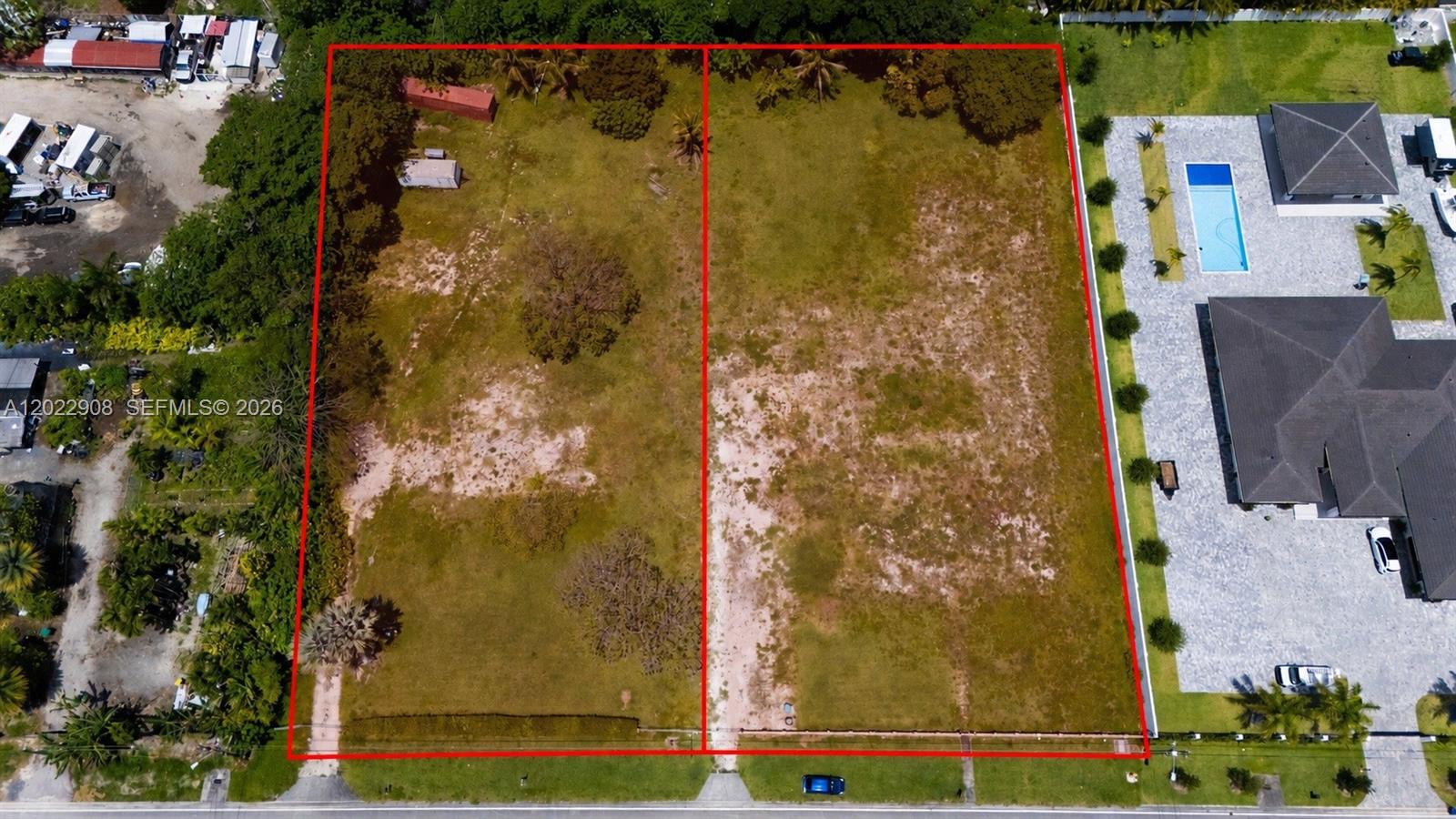 An aerial view shows two adjacent vacant lots outlined in red next to a house — 12085 SW 47th St, Miami FL 33175, MIAMI, FL