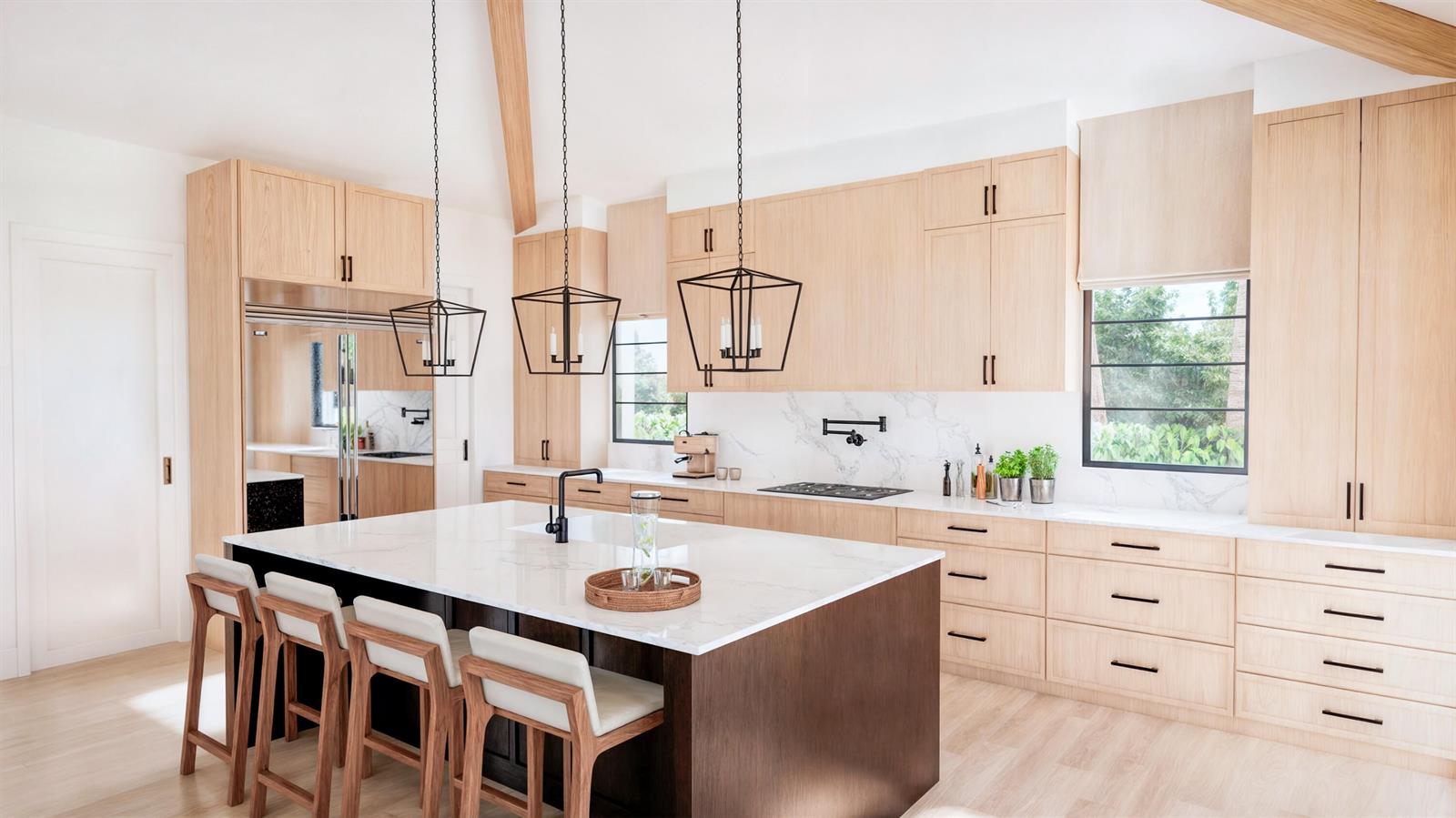 A modern kitchen features light wood cabinetry, a dark island with white countertops, and pendant lighting — 1240 Aryana Way, Delray Beach FL 33445, DELRAY BEACH, FL