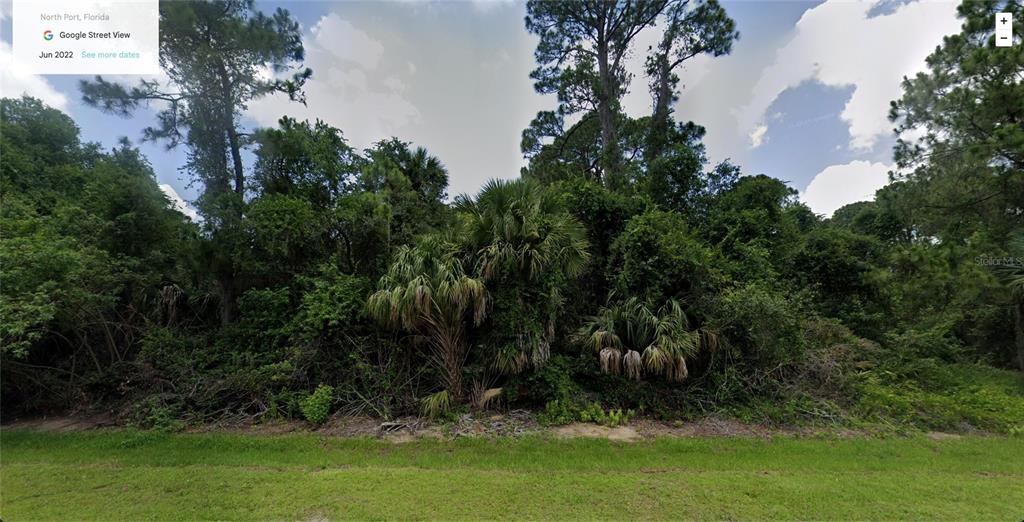 A dense, wooded vacant lot in North Port, Florida, covered in trees and underbrush — ATWATER DRIVE, NORTH PORT, FL