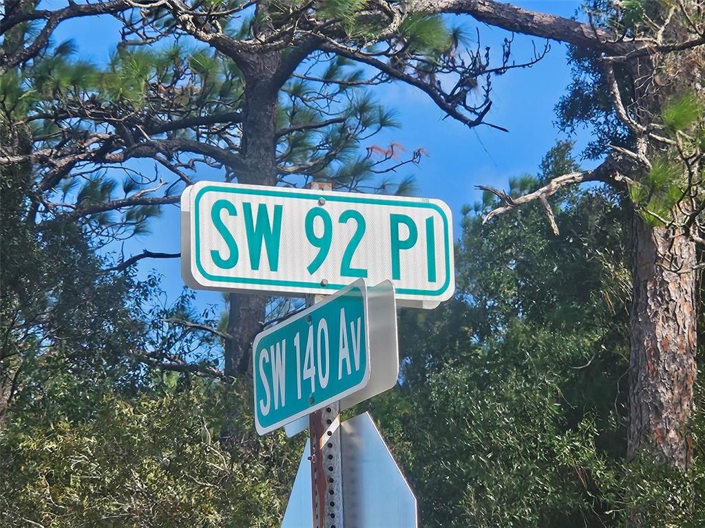 A street sign showing the intersection of SW 92 Pl and SW 140 Av — 13099 SW 92ND PLACE, DUNNELLON, FL