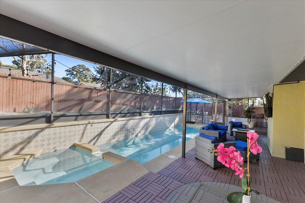An aerial view shows a single-story brick house with a gray roof and concrete driveway — 986 TURKEY HOLLOW CIRCLE, WINTER SPRINGS, FL