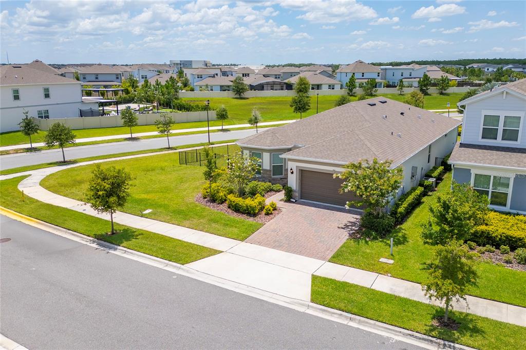An aerial view shows a single-story suburban house with a paved driveway and landscaped yard — 13270 PANAMA BEACH COURT, ORLANDO, FL