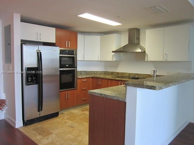 A kitchen features stainless steel appliances, wood and white cabinetry, and granite countertops — 170 SE 14th St # 2306, Miami FL 33131, MIAMI, FL