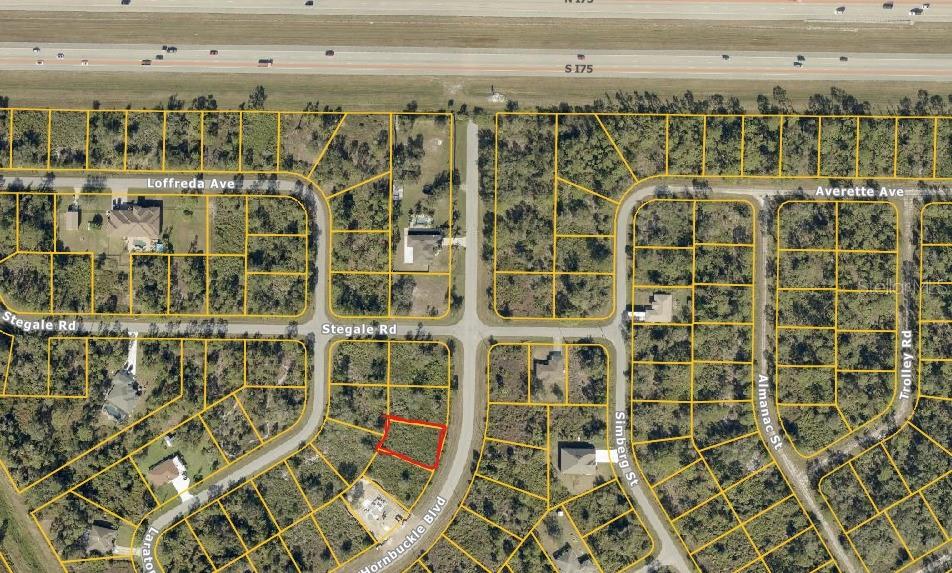 This is an aerial map showing a vacant lot outlined in red within a residential neighborhood — HORNBUCKLE BOULEVARD, NORTH PORT, FL