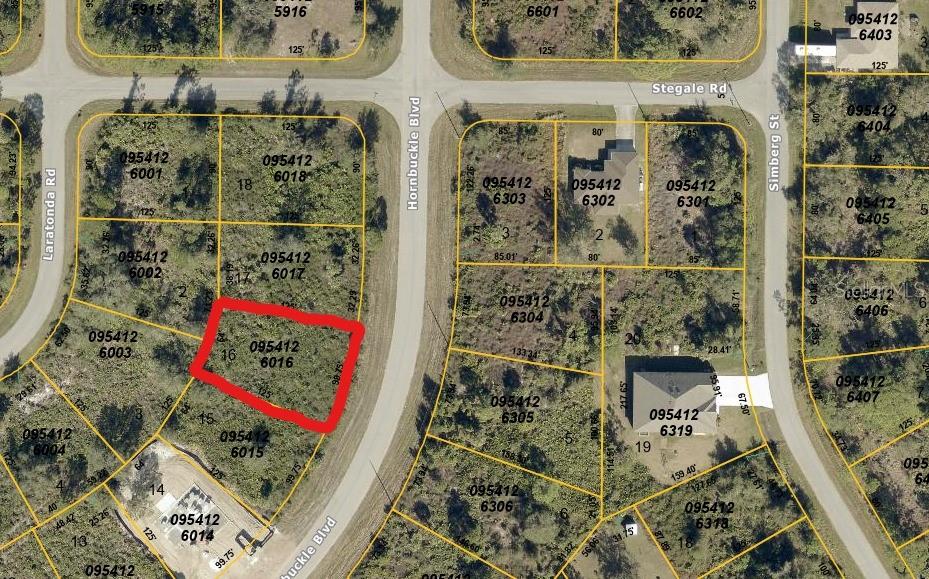 This is a satellite map showing a vacant residential lot outlined in red — HORNBUCKLE BOULEVARD, NORTH PORT, FL