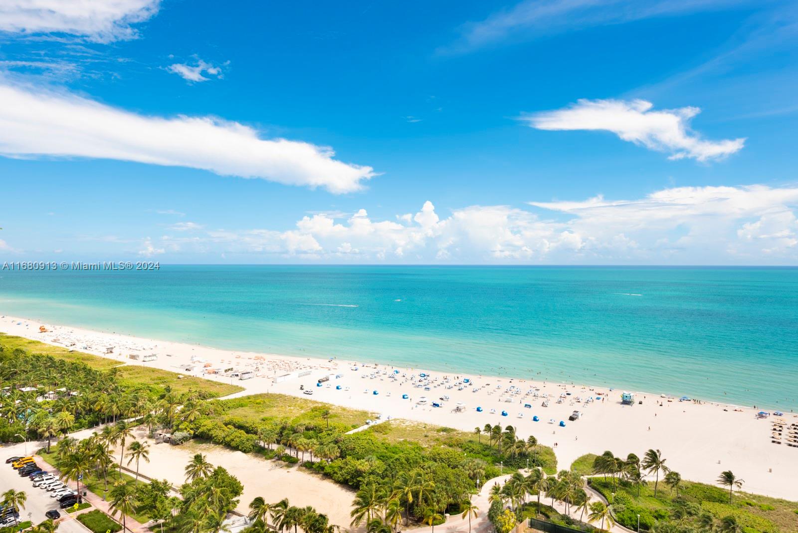An aerial view of a sandy beach with palm trees and the ocean — 101 20TH ST # 2603, Miami Beach FL 33139, MIAMI BEACH, FL