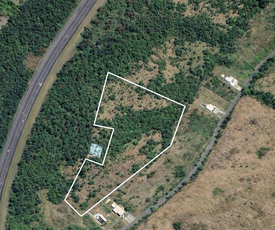 An aerial view shows a plot of land with a white boundary outline — SR 100 CAMINO LOS MARTINEZ, CABO ROJO, PR