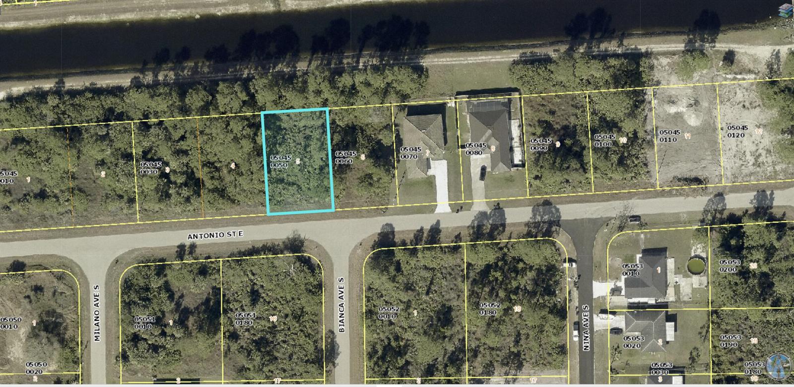 This is an aerial map showing a vacant residential lot highlighted in blue — 1235 Antonio Street E, Lehigh Acres FL 33974, LEHIGH ACRES, FL