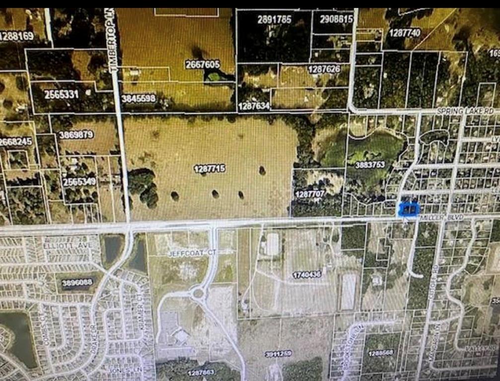 This is a satellite map showing property parcel boundaries and road networks in a rural area — 1639 MILLER BOULEVARD, FRUITLAND PARK, FL