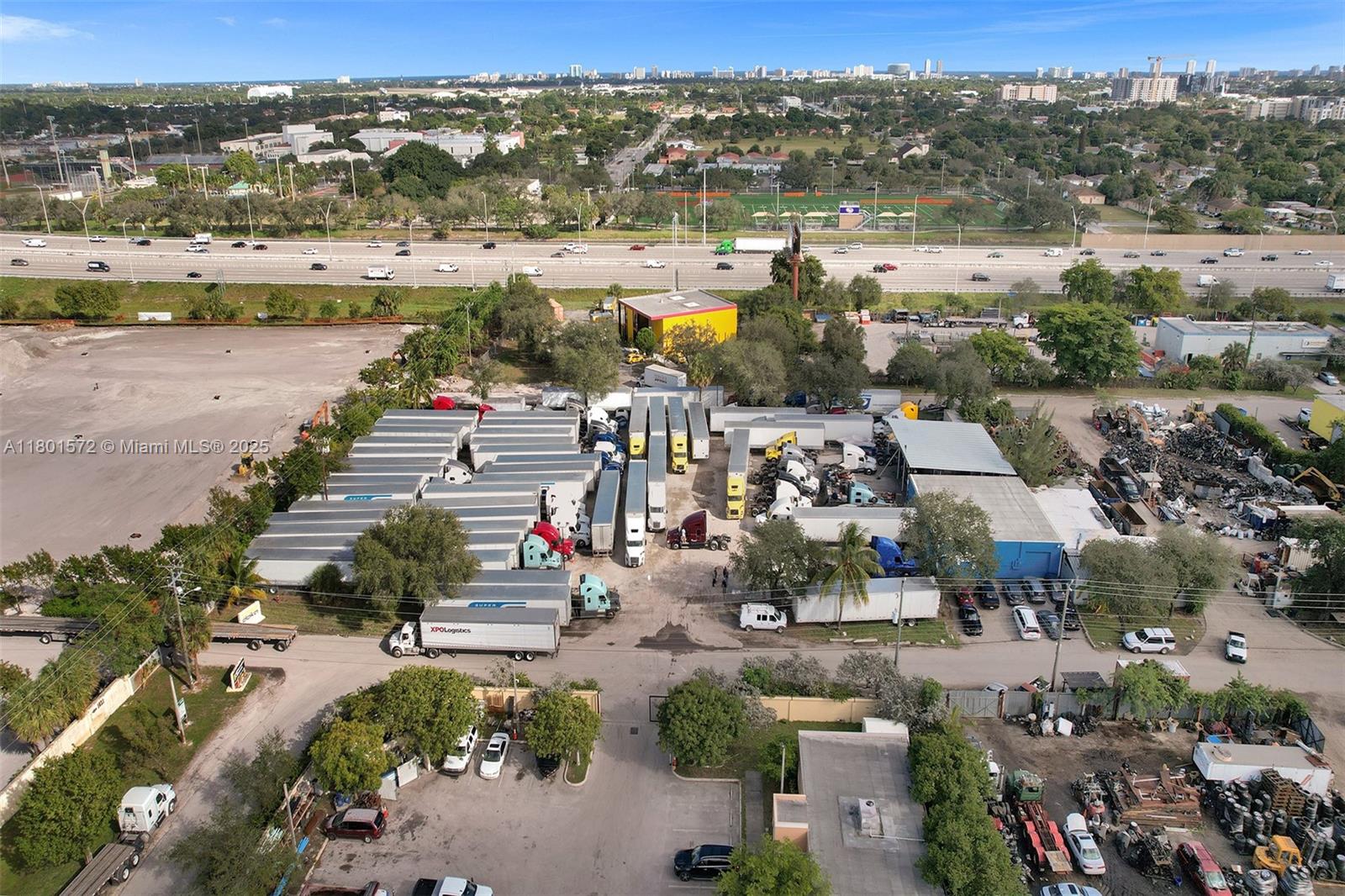 An aerial view shows a commercial truck storage yard with numerous trailers and parked vehicles — 850 NW 12th Ter, Pompano Beach FL 33069, POMPANO BEACH, FL