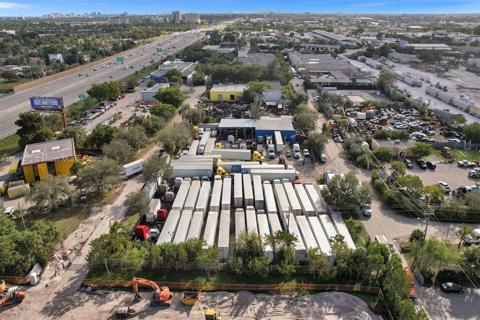An aerial view shows a commercial lot filled with numerous semi-trailers parked near a highway — 850 NW 12th Ter, Pompano Beach FL 33069, POMPANO BEACH, FL