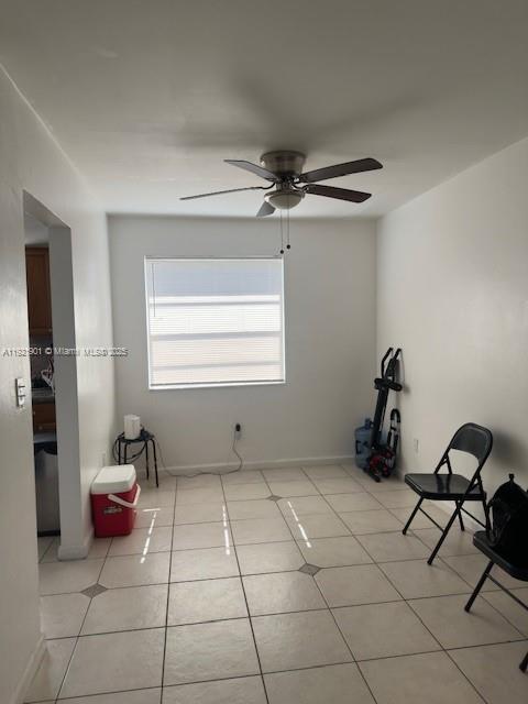 A room with white walls, a ceiling fan, a window with blinds, and tiled flooring — 1350 NE 119th St # 25, Miami FL 33161, MIAMI, FL