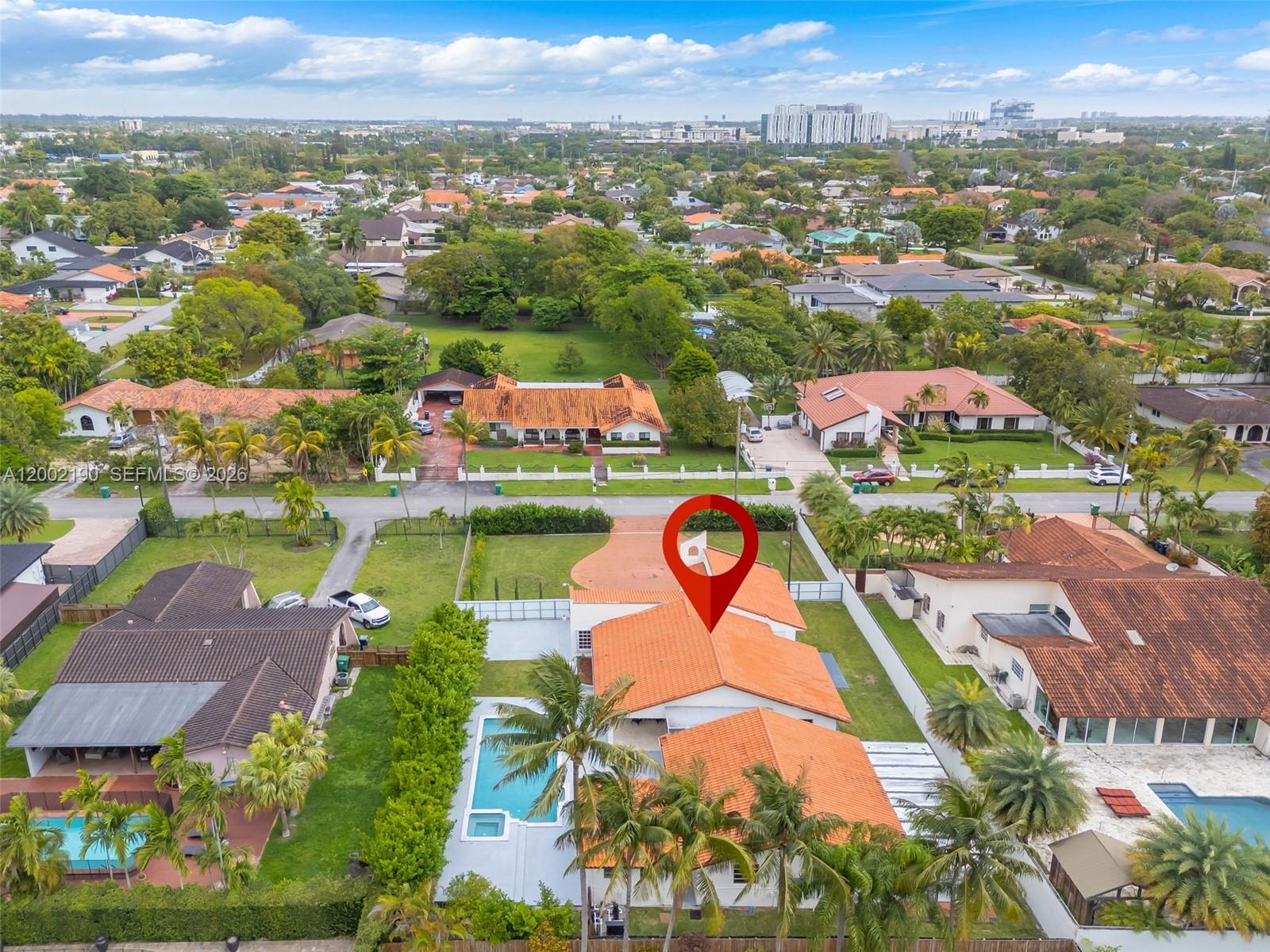 An aerial view shows a residential house with an orange tile roof and a pool — 11350 SW 30th St, Miami FL 33165, MIAMI, FL