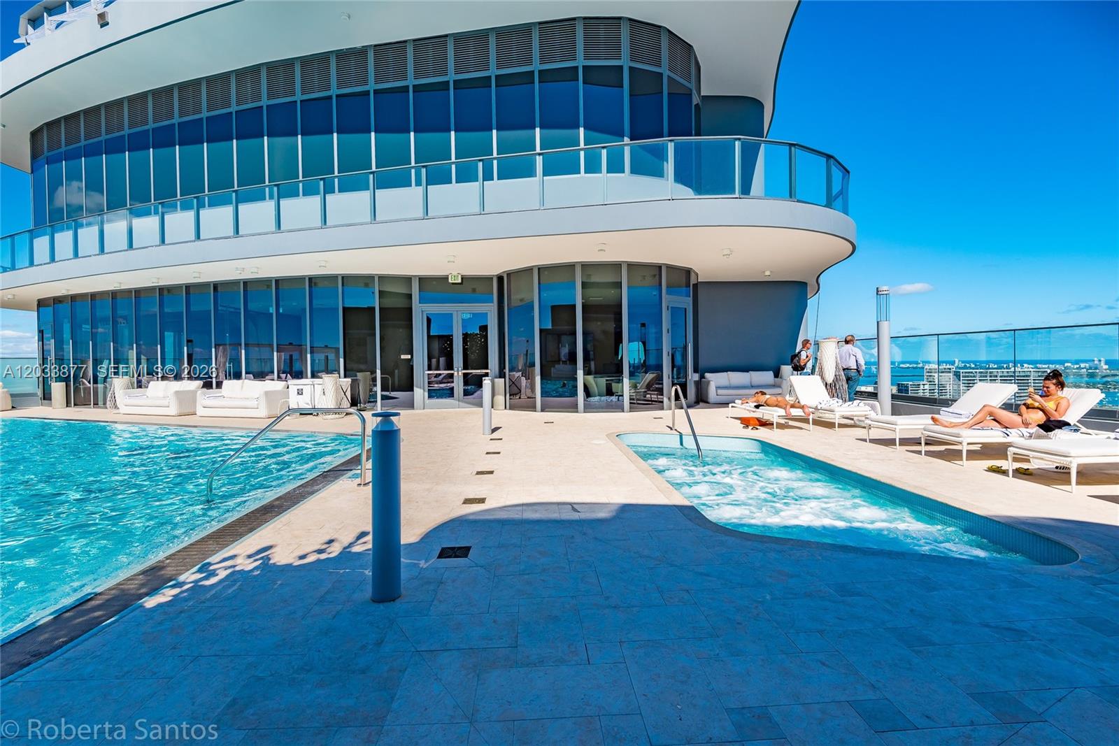 A rooftop pool deck features a swimming pool, a hot tub, and lounge chairs — 1000 Brickell Plaza # 4509, Miami FL 33131, MIAMI, FL