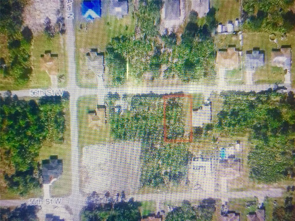 An aerial map view shows a rectangular lot outlined in red within a residential neighborhood — 3109 56TH STREET W, LEHIGH ACRES, FL