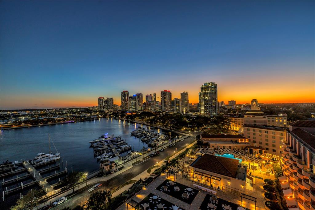 An elevated view of a marina and city skyline at sunset — 555 5TH AVENUE NE UNIT PH1, ST PETERSBURG, FL
