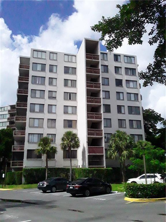 A multi-story apartment building with balconies and a parking lot in front — 4222 Inverrary Boulevard # 4109, Lauderhill FL 33319, LAUDERHILL, FL