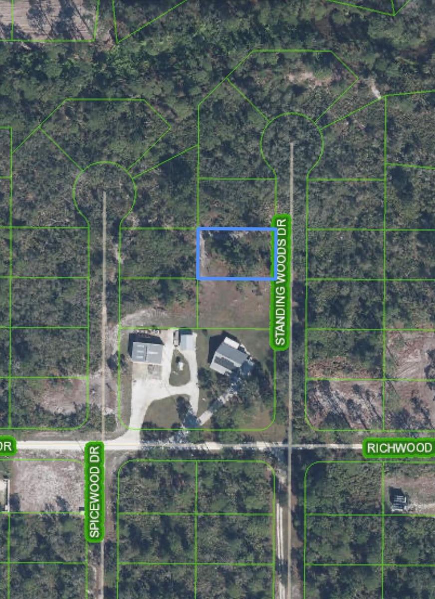An aerial map view shows a vacant rectangular lot highlighted in blue on a wooded street — 10131 Standing Woods Drive, Sebring FL 33875, SEBRING, FL