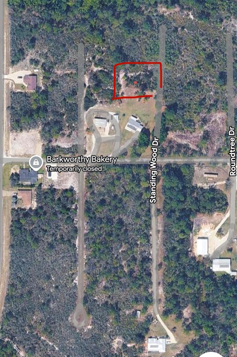 An aerial map view shows a vacant, rectangular lot outlined in red on Standing Wood Drive — 10131 Standing Woods Drive, Sebring FL 33875, SEBRING, FL