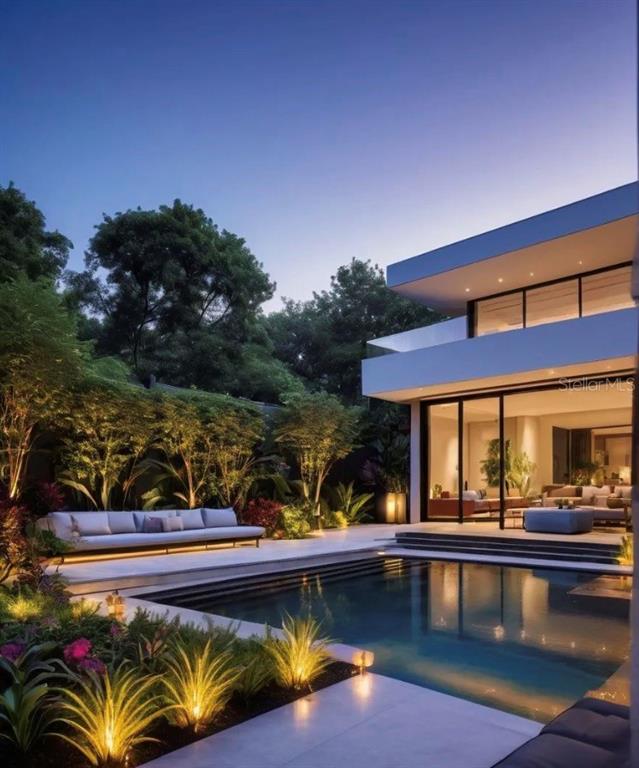 A modern two-story home features a swimming pool, outdoor seating, and illuminated landscaping at dusk — Lot 10 DORADO BCH PLANTATION, DORADO, PR