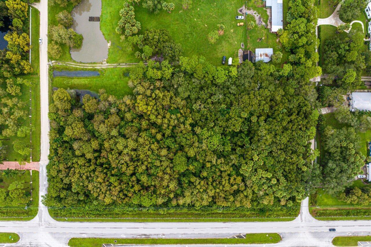 An aerial view shows a large, rectangular wooded lot bordered by a road and grass — Xxxxx Indiantown Road, Jupiter FL 33478, JUPITER, FL