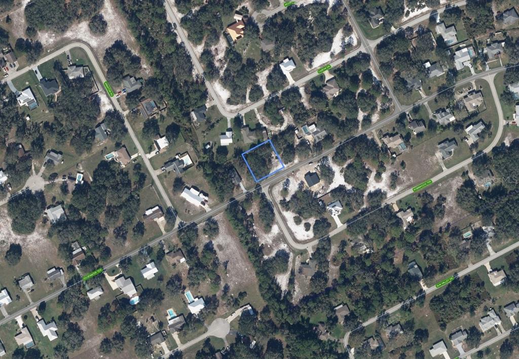 An aerial map view shows a vacant residential lot outlined in blue within a neighborhood — 5917 EDGEWATER TERRACE, SEBRING, FL