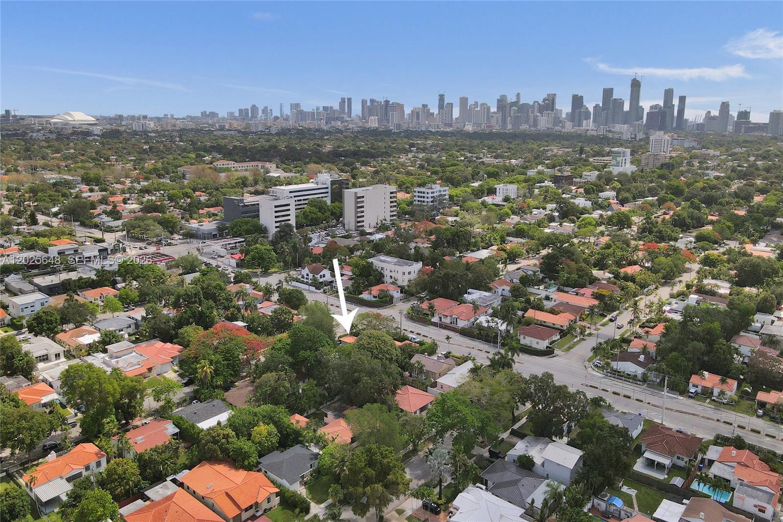An aerial view shows a residential neighborhood with a white arrow pointing to a house — 2300 SW 22nd Ave, Miami FL 33145, MIAMI, FL