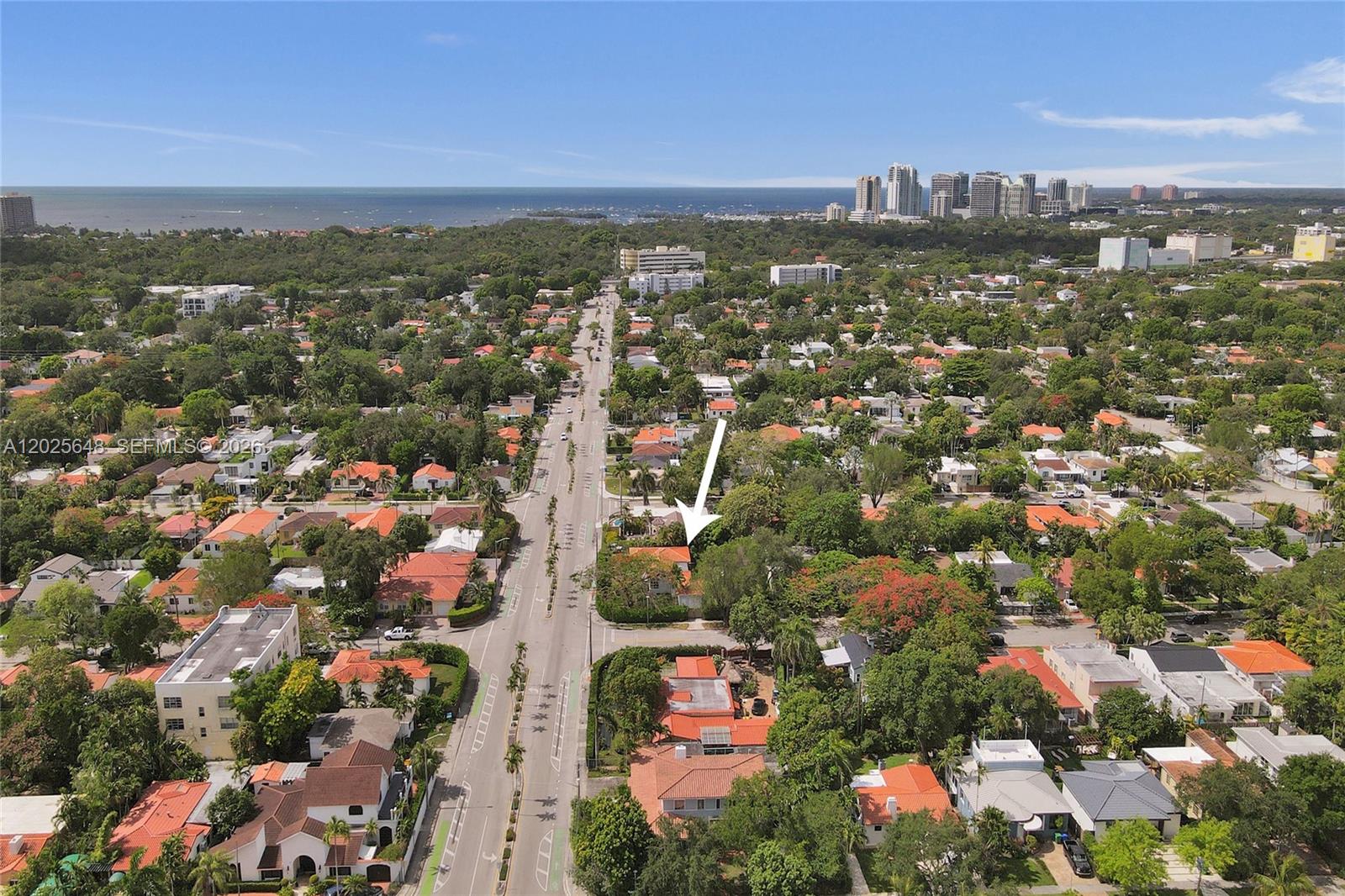 An aerial view shows a residential neighborhood with a white arrow pointing to a house — 2300 SW 22nd Ave, Miami FL 33145, MIAMI, FL