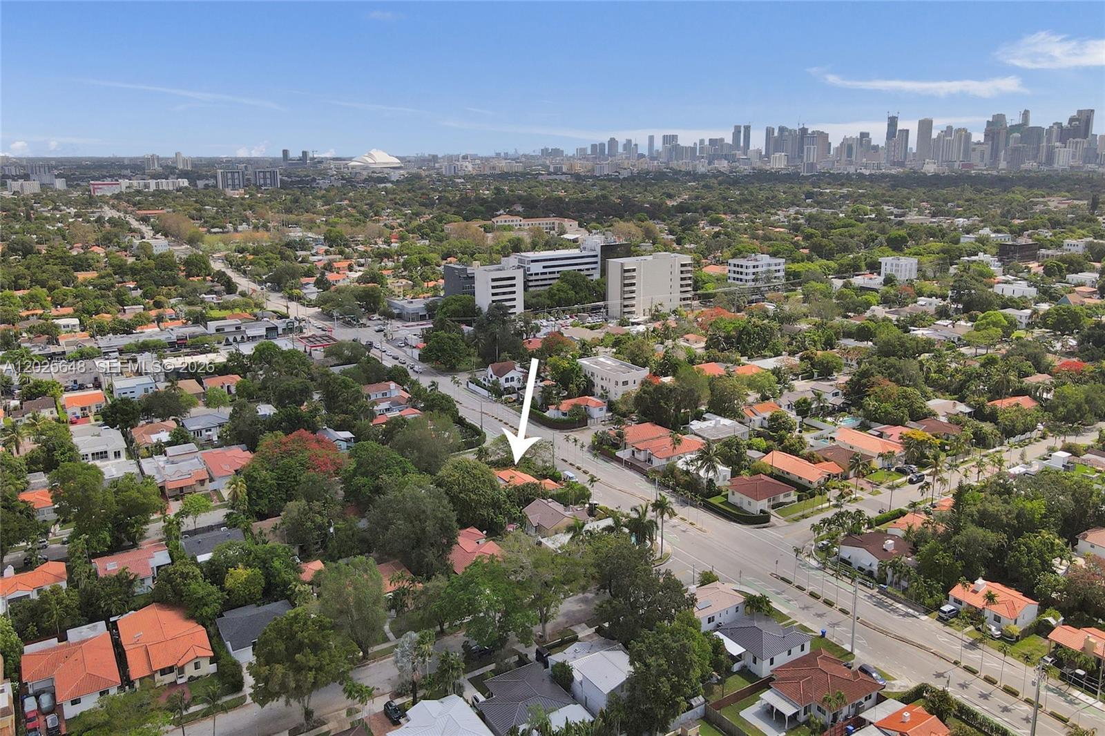 An aerial view shows a residential neighborhood with a white arrow pointing to a house — 2300 SW 22nd Ave, Miami FL 33145, MIAMI, FL