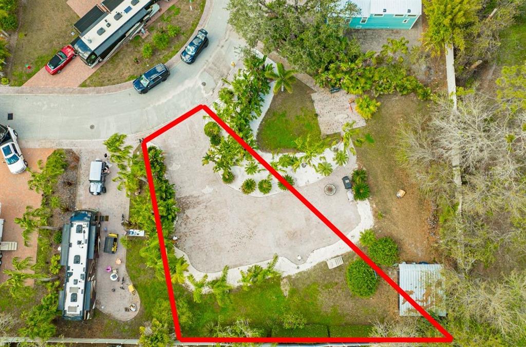 An aerial view shows a landscaped lot with a gravel driveway and a small shed — 6861 AMANDA VISTA CIRCLE, LAND O LAKES, FL