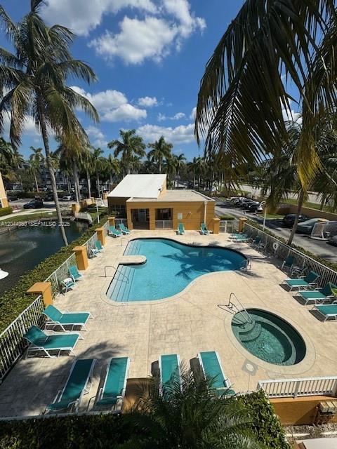 An elevated view shows a swimming pool, a hot tub, and lounge chairs on a deck — 1450 SE 3rd Ave # 302, Dania Beach FL 33004, DANIA BEACH, FL