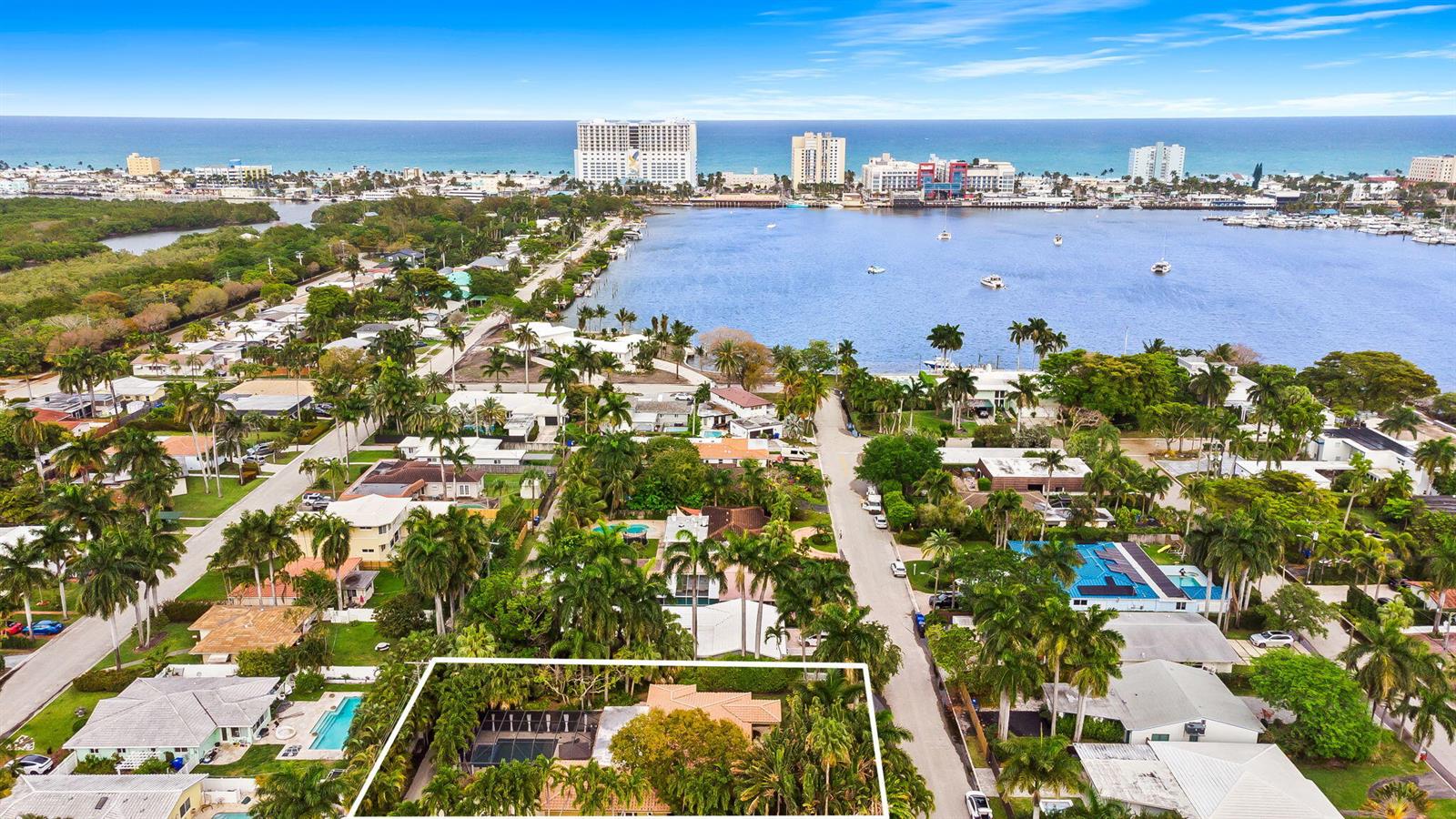 An aerial view shows a residential neighborhood with a highlighted house near the water — 939 Buchanan Street, Hollywood FL 33019, HOLLYWOOD, FL