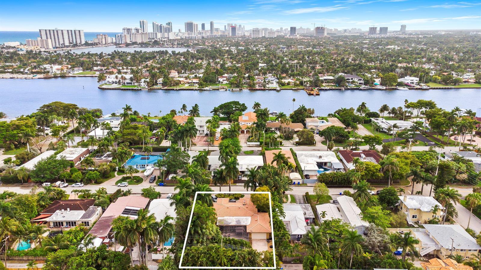 An aerial view shows a residential neighborhood with a highlighted house featuring a tile roof — 939 Buchanan Street, Hollywood FL 33019, HOLLYWOOD, FL