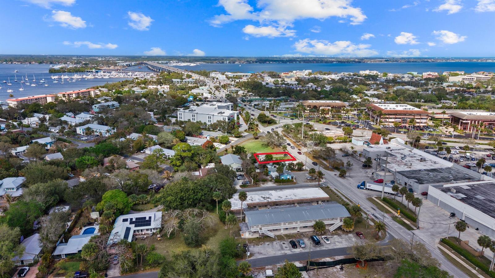 An aerial view shows a residential lot outlined in red within a coastal town — 820 SW Palm City Road, Stuart FL 34994, STUART, FL